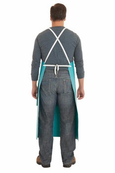 a food processing worker showing his back wearing a teal PVC apron from Ansell brand